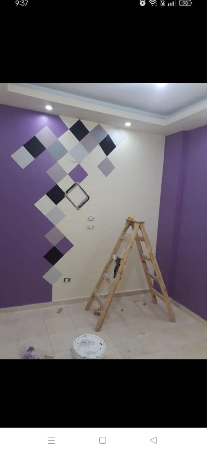 SKML painter applying a smooth exterior finish coat to a residential building in Visakhapatnam